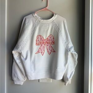 White Sweatshirt with Pink Bow Design